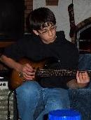 Max playing guitar